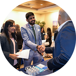 Two School of Business students participating in a career fair