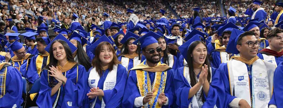 UCR Business graduating students in blue regalia at Toyota Arena