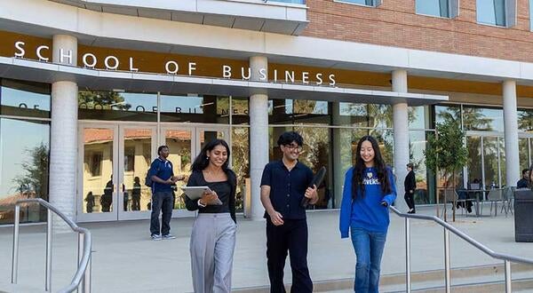 New School of Business building with students on front terrace