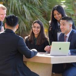 Grad students at Anderson Hall, UCR School of Business