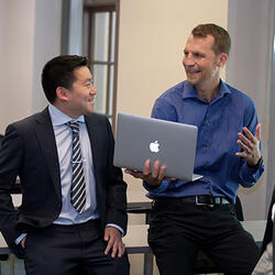 Professor Talking to students on computer