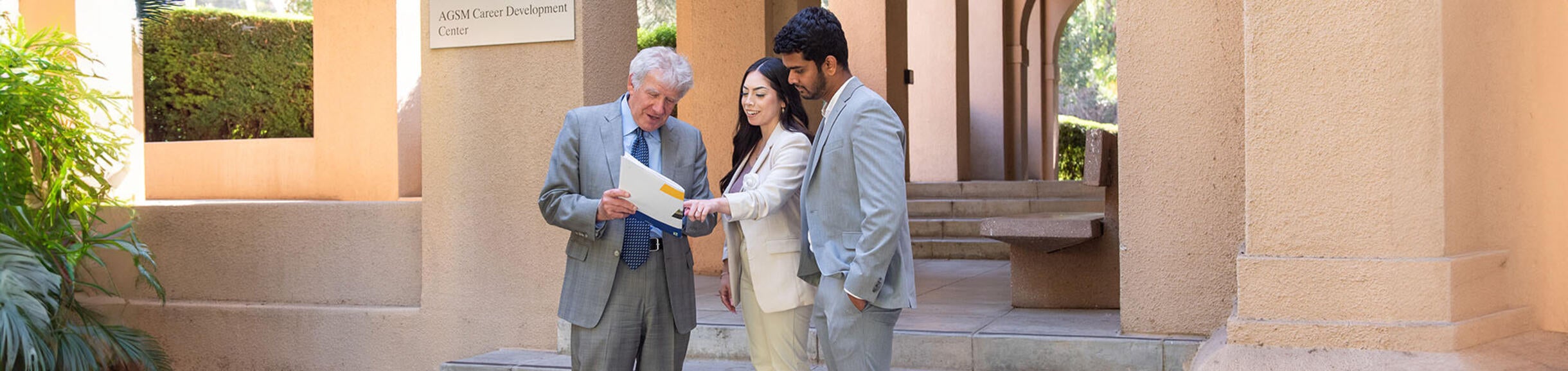 Prof. Rami Zwick with two graduate students in front of AGSM CDC