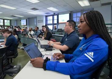 Graduate students in Anderson Hall classroom