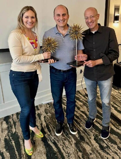 Kane Polakoff with Awards for Employees